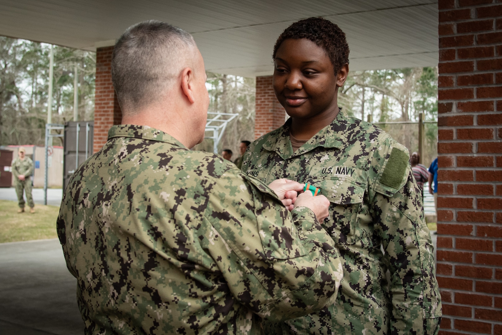 Hospitalman Meaghan Jenkins receives the Navy and Marine Corps Achievement Medal during an awards ceremony conducted Wednesday, February 28 aboard Naval Health Clinic Cherry Point.  Jenkins received the award in recognition of her earning the honor of the clinic’s 2023 Bluejacket of the Year.