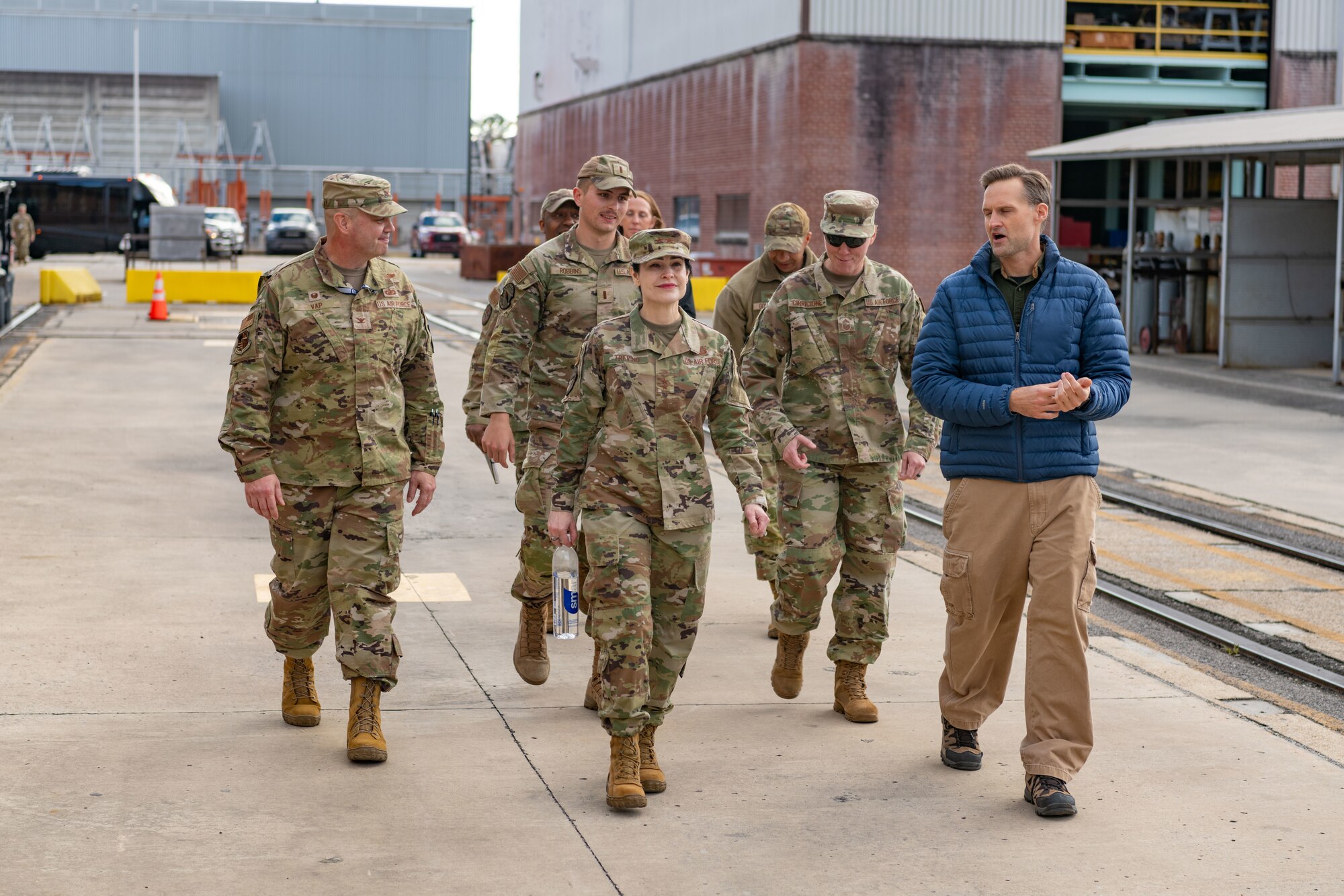 Maj. Gen. Alice Treviño, deputy assistant secretary for contracting with Office of the Assistant Secretary of the Air Force for Acquisition, Technology and Logistics, center, listens Dec. 5, 2023, as Dr. Rich Roberts, flight director at Arnold Engineering Development Complex, right, discusses some of the capabilities of the 716th Test Squadron. During her visit to Arnold Air Force Base, Tenn., headquarters of AEDC, Treviño met with members of the Arnold contracting team and toured several Arnold test facilities and sites on base where work is performed to support the test mission. (U.S. Air Force photo by Keith Thornburgh)