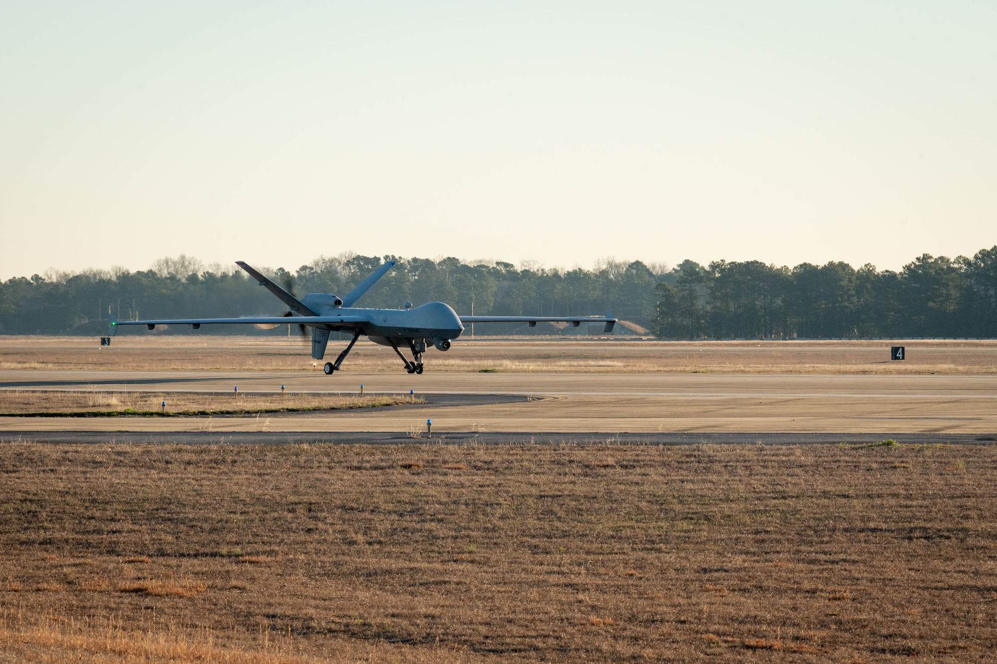 Plane landing on runway.