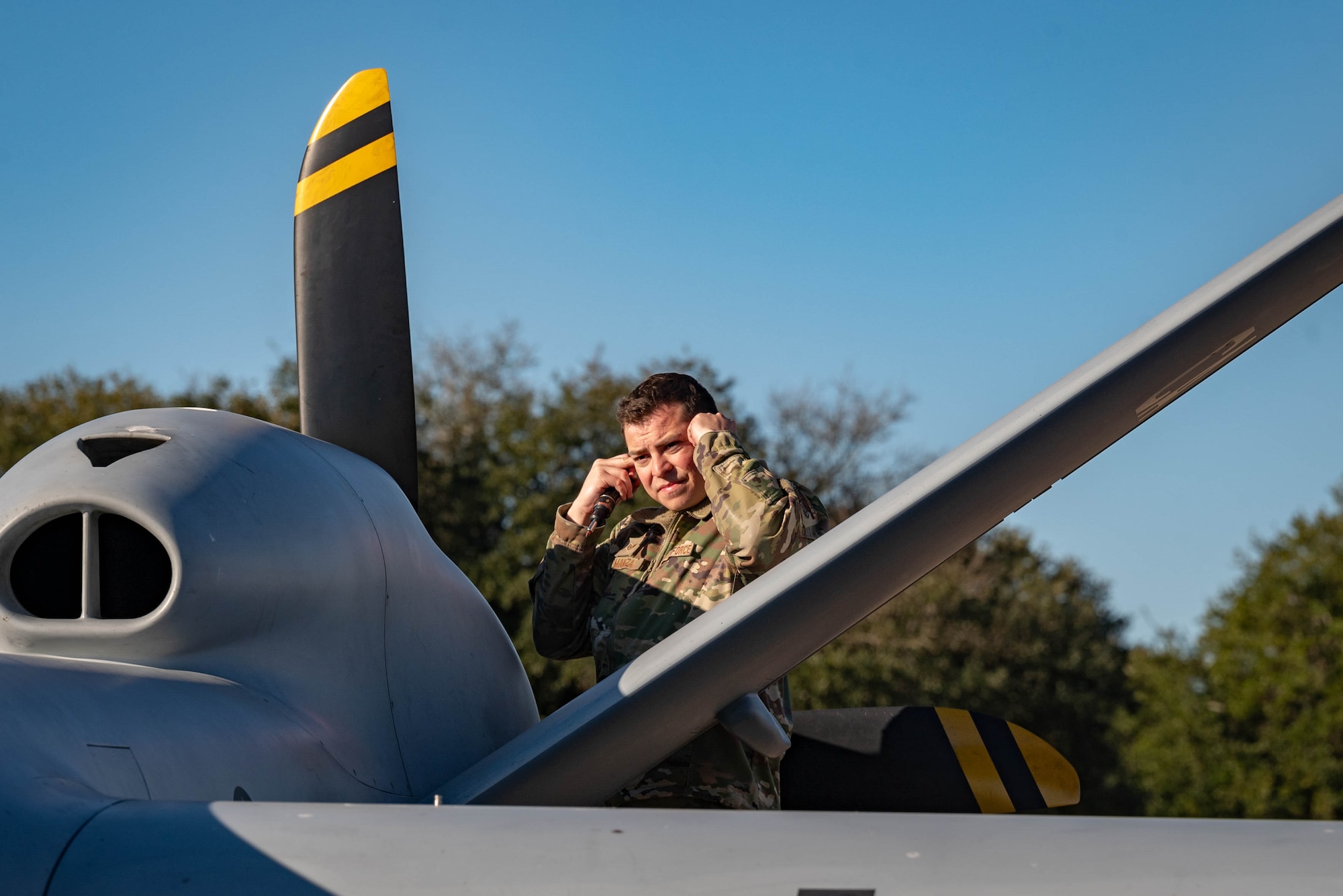 Man adjusting ear protection.