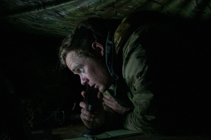 Airman uses communications equipment