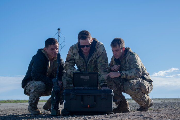 Airmen look at battle management tool