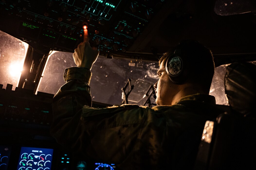 U.S. Air Force 1st Lt. Jesse Havener, 3rd Airlift Squadron pilot, starts engines during a local evening training sortie at Dover Air Force Base, Delaware, Feb. 26, 2024. The 3rd AS conducted local training in preparation to support worldwide airlift capabilities to include clandestine delivery, extraction and airdrop of special operations forces and equipment. (U.S. Air Force photo by Airman 1st Class Amanda Jett)