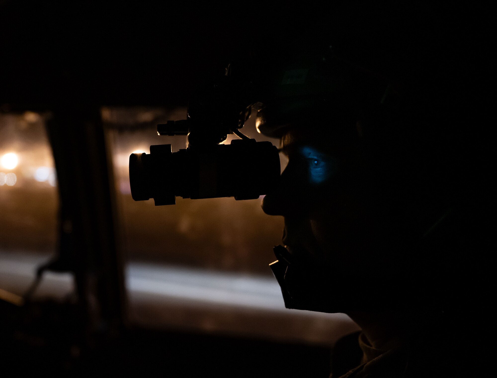 U.S. Air Force Maj. Alexander Hanna, Air Mobility Command Test and Evaluation Squadron pilot, looks through his night vision goggles before take off on a local evening training sortie at Dover Air Force Base, Delaware, Feb. 26, 2024. Hanna flew with the 3rd Airlift Squadron during a local training flight in preparation to support worldwide airlift capabilities to include clandestine delivery, extraction and airdrop of special operations forces and equipment. (U.S. Air Force photo by Airman 1st Class Amanda Jett)