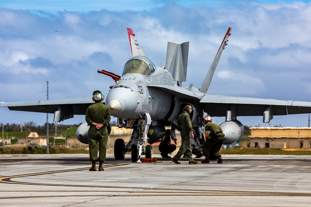 U.S. Marines with Marine Fighter Attack Squadron (VMFA) 232 performs preflight inspections on an F/A-18C Hornet aircraft at Andersen Air Force Base, Guam, Jan. 30, 2024. Nicknamed the “Red Devils,” VMFA-232 traveled from Marine Corps Air Station Iwakuni, Japan to Guam as a part of their Aviation Training Relocation Program deployment to train multilaterally with allies and partners, and enhance the squadron’s combat readiness. (U.S. Marine Corps photo by Lance Cpl. David Getz)