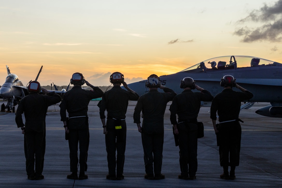 U.S. Marines with Marine Fighter Attack Squadron (VMFA) 232 salute a departing F/A-18D at Andersen Air Force Base, Guam, Feb. 1, 2024. Nicknamed the “Red Devils,” VMFA-232 traveled from Marine Corps Air Station Iwakuni, Japan to Guam as a part of their Aviation Training Relocation Program deployment to train multilaterally with allies and partners, and enhance the squadron’s combat readiness. (U.S. Marine Corps photo by Sgt. Jose Angeles)