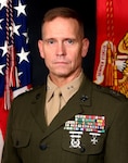 A light skinned man in a green Marine Corps uniform