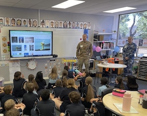 U.S. Space Force Major Dustin O’Donnell (left) and Royal Australian Air Force Leading Aircraftwoman Amy Clements (right) visit with year 5 students to discuss current space technologies and their daily impact at Vale Park Primary School in Adelaide, South Australia, on December 1, 2023. Students learned about the vital role GPS plays in traveling from one place to another, as well as the exciting capabilities of the Space Surveillance Telescope. (Courtesy photo)