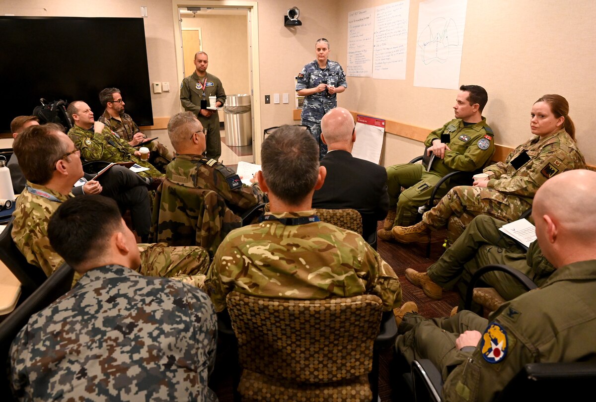 Multinational attendees participate in the Agile Combat Employment Conference at the Pentagon, Arlington, Va., Feb. 28, 2024. Combat employment experts from Australia, Canada, France, Japan, New Zealand, South Korea, the United Kingdom and the U.S. gathered to strategize ways to improve integration of airpower. Images have been digitally altered to obscure security badges. (U.S. Air Force photo by Staff Sgt. Stuart Bright)