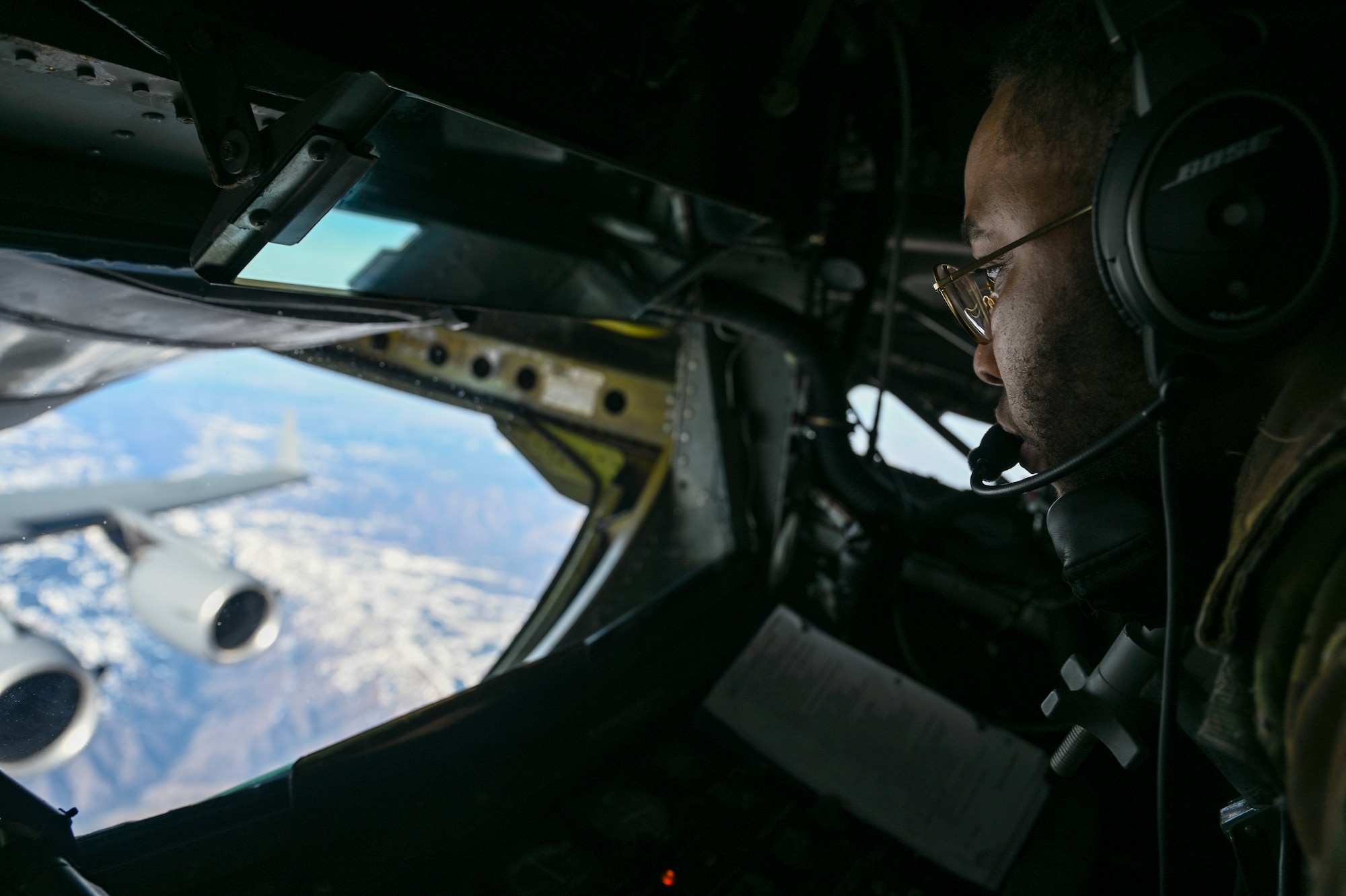 An Airman aerial refuels an C-17 aircraft