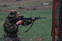 U.S. Marine Corps Gunnery Sgt. Elkan Meyer, the uniformed readiness coordinator and substance abuse control officer with 1st Recruit Training Battalion and a member of the Edson Range shooting team, engages a target during an action rifle stage at the Marine Corps Marksmanship Competition West at Marine Corps Base Camp Pendleton, California, Feb. 23, 2024. Meyer is a native of Cary, Illinois. The MCMC West was held in conjunction with several other competitions around the Marine Corps to find the top 10 percent of shooters who will go on to compete in the national tournament in Quantico, Virginia for a place on the Marine Corps Shooting Team. (U.S. Marine Corps photo by Cpl. Alexander O. Devereux)