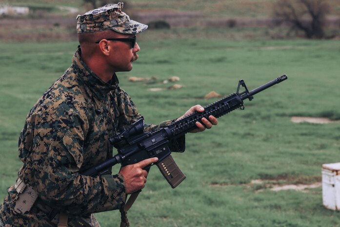 U.S. Marine Corps Cpl. Joseph Dement, a chief combat marksmanship trainer course instructor with Weapons and Field Training Battalion and a member of the Edson Range shooting team, engages a target during an action rifle stage at the Marine Corps Marksmanship Competition West at Marine Corps Base Camp Pendleton, California, Feb. 23, 2024. Dement is a native of Hoyt Lakes, Minnesota. The MCMC West was held in conjunction with several other competitions around the Marine Corps to find the top 10 percent of shooters who will go on to compete in the national tournament in Quantico, Virginia for a place on the Marine Corps Shooting Team. (U.S. Marine Corps photo by Cpl. Alexander O. Devereux)
