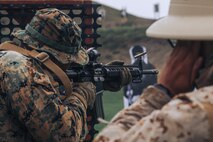 U.S. Marine Corps Cpl. Alexander Devereux, a combat photographer with Headquarters Service Battalion, Marine Corps Recruit Depot San Diego and a member of the Edson Range shooting team, engages a target during an action rifle stage at the Marine Corps Marksmanship Competition West at Marine Corps Base Camp Pendleton, California, Feb. 23, 2024. Devereux is a native of Farmington Hills, Michigan. The MCMC West was held in conjunction with several other competitions around the Marine Corps to find the top 10 percent of shooters who will go on to compete in the national tournament in Quantico, Virginia for a place on the Marine Corps Shooting Team. (U.S. Marine Corps courtesy asset by Sgt. Alejandro Mendoza)