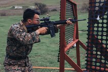U.S. Marine Corps Sgt. Ceaser Verdin, a drill instructor with Support Training Battalion, Marine Corps Recruit Depot San Diego and a member of the Edson Range shooting team, engages a target during an action rifle stage at the Marine Corps Marksmanship Competition West at Marine Corps Base Camp Pendleton, California, Feb. 23, 2024. Verdin is a native of Pomona, California. The MCMC West was held in conjunction with several other competitions around the Marine Corps to find the top 10 percent of shooters who will go on to compete in the national tournament in Quantico, Virginia for a place on the Marine Corps Shooting Team. (U.S. Marine Corps photo by Cpl. Alexander O. Devereux)