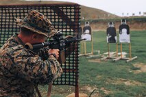 U.S. Marine Corps Staff Sgt. Loren Smith, chief academic instructor, Support Training Battalion, Marine Corps Recruit Depot San Diego and a member of the Edson Range shooting team, engages a target during an action rifle stage at the Marine Corps Marksmanship Competition West at Marine Corps Base Camp Pendleton, California, Feb. 23, 2024. Smith is a native of Cascade, Idaho. The MCMC West was held in conjunction with several other competitions around the Marine Corps to find the top 10 percent of shooters who will go on to compete in the national tournament in Quantico, Virginia for a place on the Marine Corps Shooting Team. (U.S. Marine Corps photo by Cpl. Alexander O. Devereux)