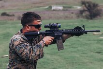 U.S. Marine Corps Sgt. Justin Garvey-Lease, a chief combat marksmanship coaches course instructor with Weapons and Field Training Battalion and a member of the Edson Range shooting team, engages a target during an action rifle stage at the Marine Corps Marksmanship Competition West at Marine Corps Base Camp Pendleton, California, Feb. 23, 2024. Garvey is a native of Omaha, Nebraska. The MCMC West was held in conjunction with several other competitions around the Marine Corps to find the top 10 percent of shooters who will go on to compete in the national tournament in Quantico, Virginia for a place on the Marine Corps Shooting Team. (U.S. Marine Corps photo by Cpl. Alexander O. Devereux)