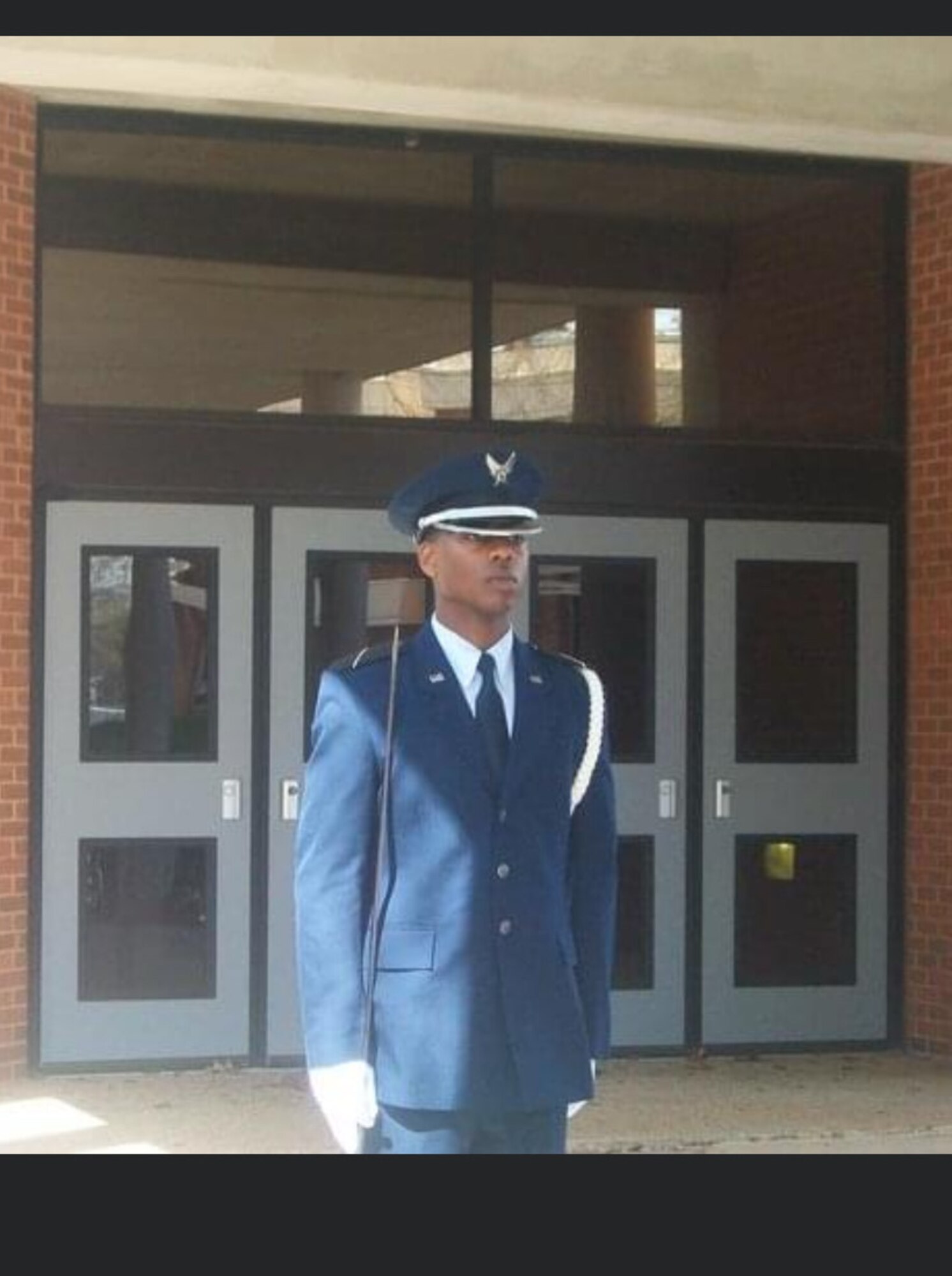 U.S. Air Force Maj. Gabriel Byrd stands at attention at Tuskegee University.