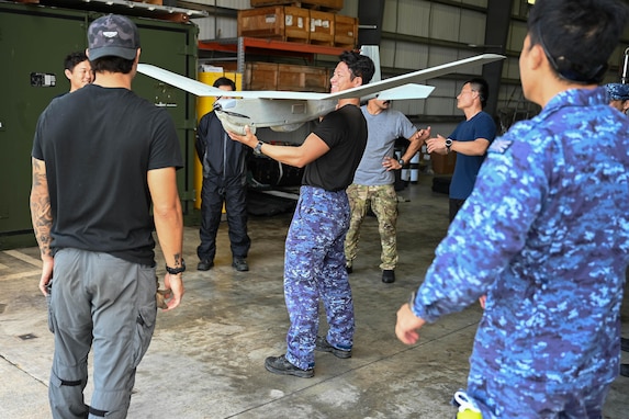 West Coast-based Naval special warfare operators train members of a Japanese Special Boat Unit on AeroVironment RQ-20 Puma operations at Naval Base White Beach in Okinawa, Japan. Naval Special Warfare is the nation's elite maritime special operations force, uniquely positioned to extend the Fleet's reach and gain and maintain access for the Joint Force in competition and conflict.