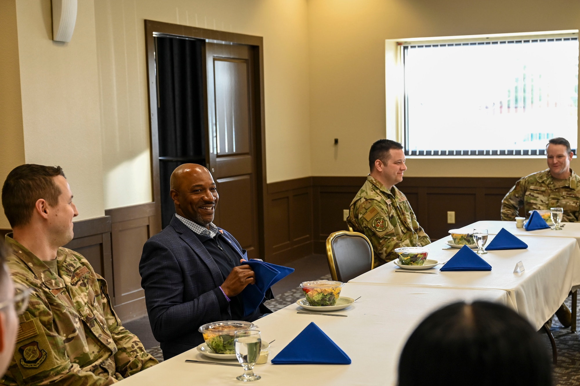 Men sit at a table.