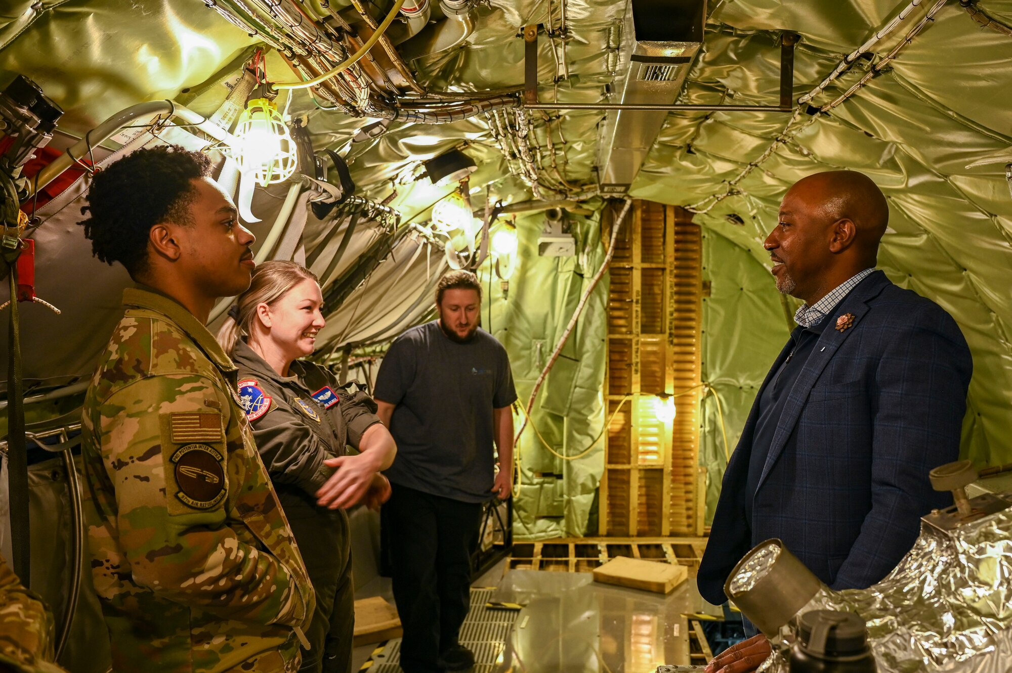 A man tours an Air Force jet.