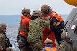 U.S. Navy Divers assigned to Explosive Ordnance Disposal Mobile Unit 1 help NASA Astronaut U.S. Navy Capt. Victor J. Glover Jr. out of a crew module test article (CMTA) during Underway Recovery Test 11, Feb. 25, 2024. In preparation for NASA’s Artemis II crewed mission, which will send four astronauts in Orion beyond the Moon, NASA and the Department of Defense will conduct a series of tests to demonstrate and evaluate the processes, procedures and hardware used in recovery operations for crewed lunar missions. Amphibious transport docks, like USS San Diego, have unique capabilities that make it an ideal partner to support NASA, including embarking helicopters, launching and recovering small boats, three dimensional air search radar and advanced medical facilities. (U.S. Navy photo by Mass Communication Specialist 2nd Class Connor Burns)