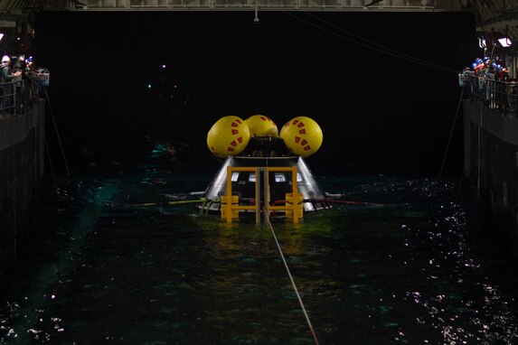 U.S. Navy Sailors assigned to San Antonio class amphibious ship USS San Diego (LPD 22) and NASA personnel launch a crew module test article (CMTA) for night-time training while underway for NASA’s Underway Recovery Test 11, Feb. 22, 2024. In preparation for NASA’s Artemis II crewed mission, which will send four astronauts in Orion beyond the Moon, NASA and the Department of Defense will conduct a series of tests to demonstrate and evaluate the processes, procedures, and hardware used in recovery operations for crewed lunar missions. The U.S. Navy has many unique capabilities that make it an ideal partner to support NASA, including its amphibious ships with the ability to embark helicopters, launch and recover small boats, three-dimensional air search radar and advanced medical facilities. (U.S. Navy photo by Mass Communication Specialist 2nd Class Olivia Rucker)