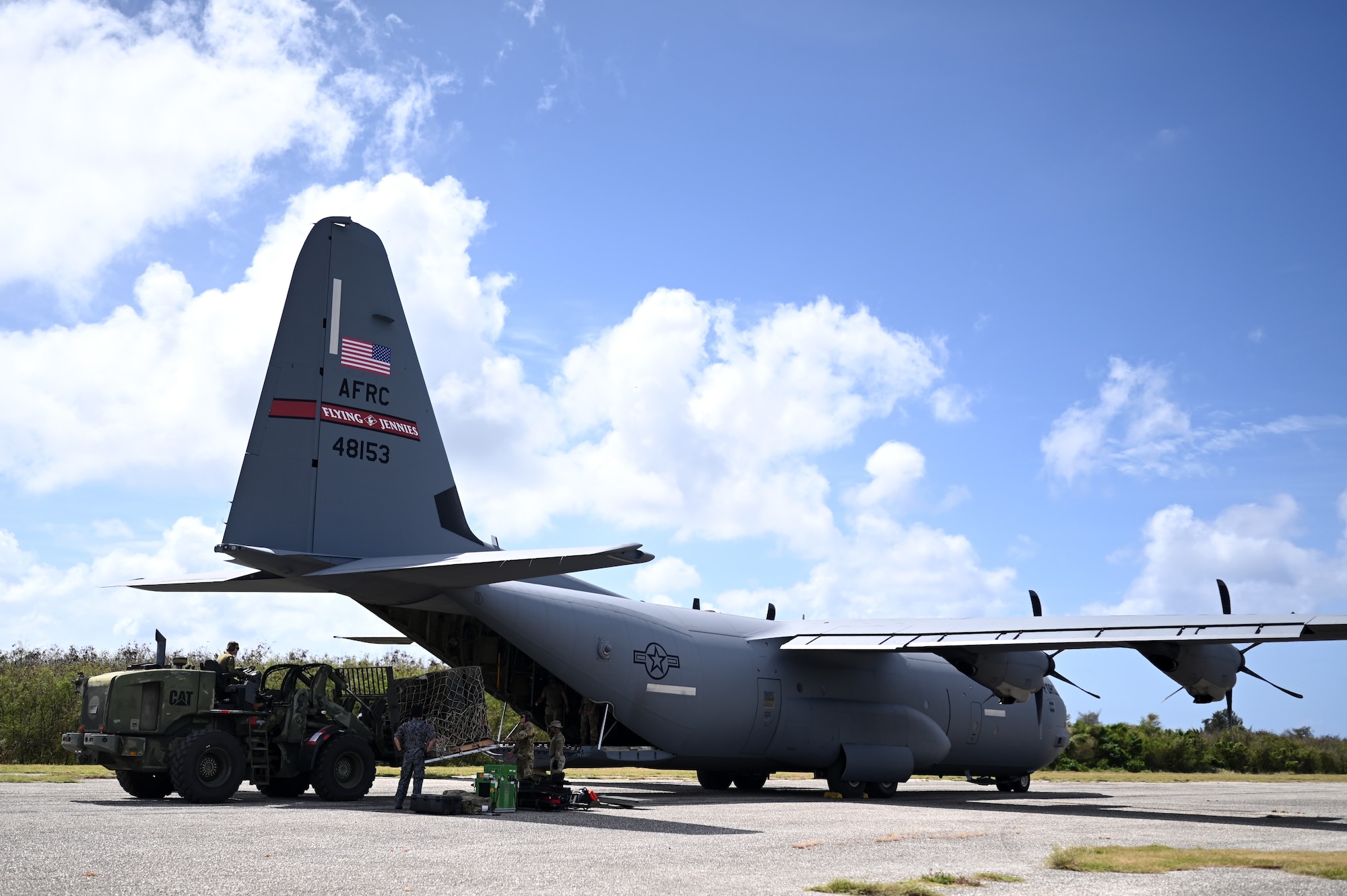 Airmen loading C-130J with cargo