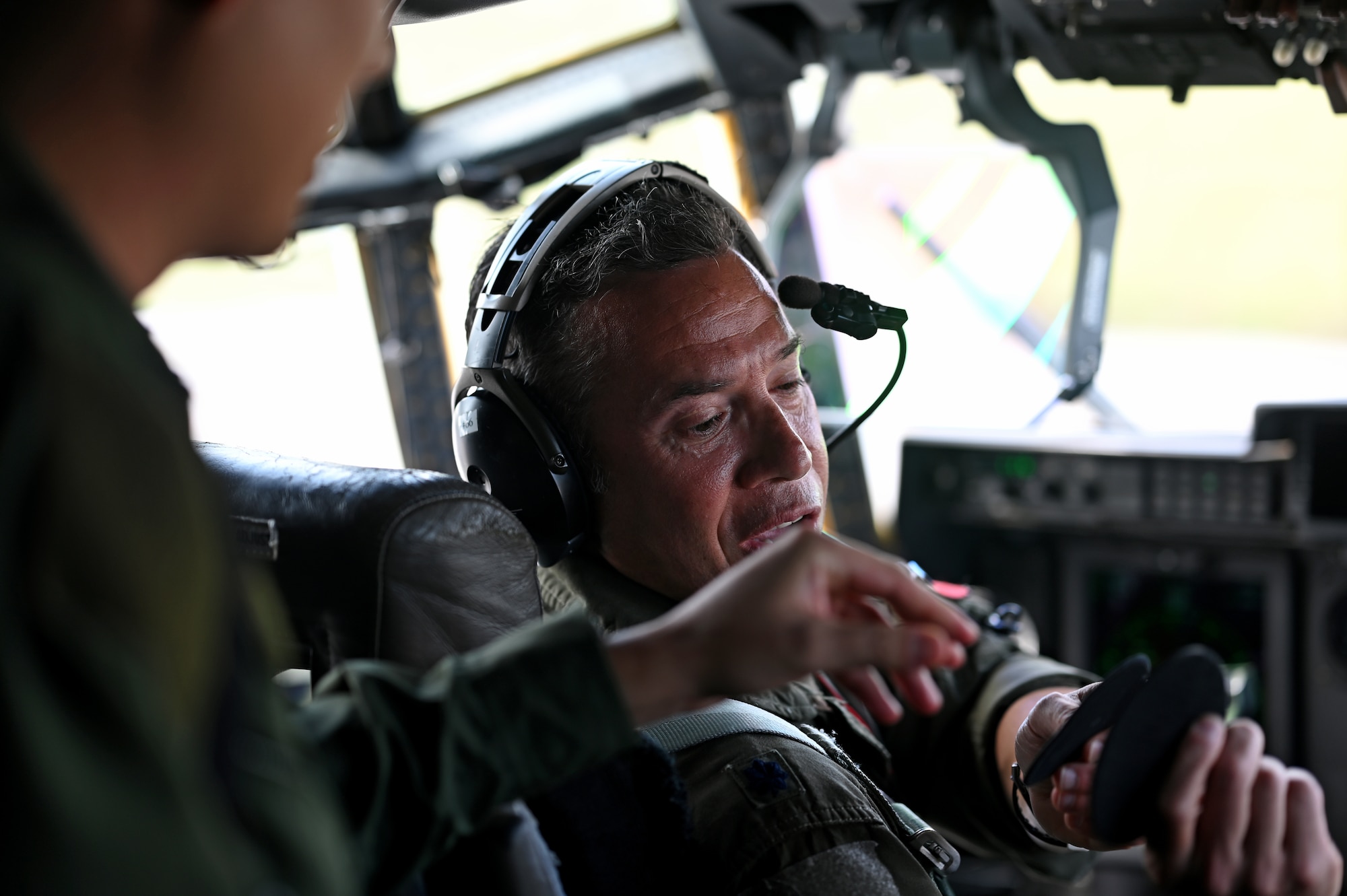 Pilot preparing for flight in C-130J