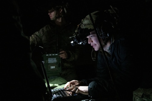 Airman uses battle management tool at night