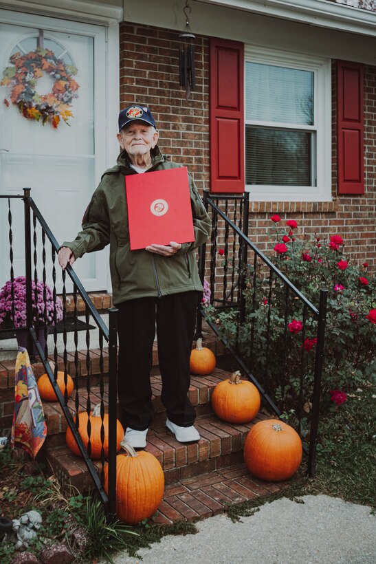 Retired U.S. Marine Corps Staff Sgt. Ismael Gonzalez-Ramos, a former infantry unit leader and decorated combat veteran, poses for a photo with his certificate of retirement at his home in Jacksonville, North Carolina, Nov. 20, 2023. 92-year-old Gonzales-Ramos was drafted from Cidra, Puerto Rico in 1951 and served in the Korean War and Vietnam War during his 20 years of honorable service in the Marine Corps. (U.S. Marine Corps photo by Lance Cpl. Loriann Dauscher)