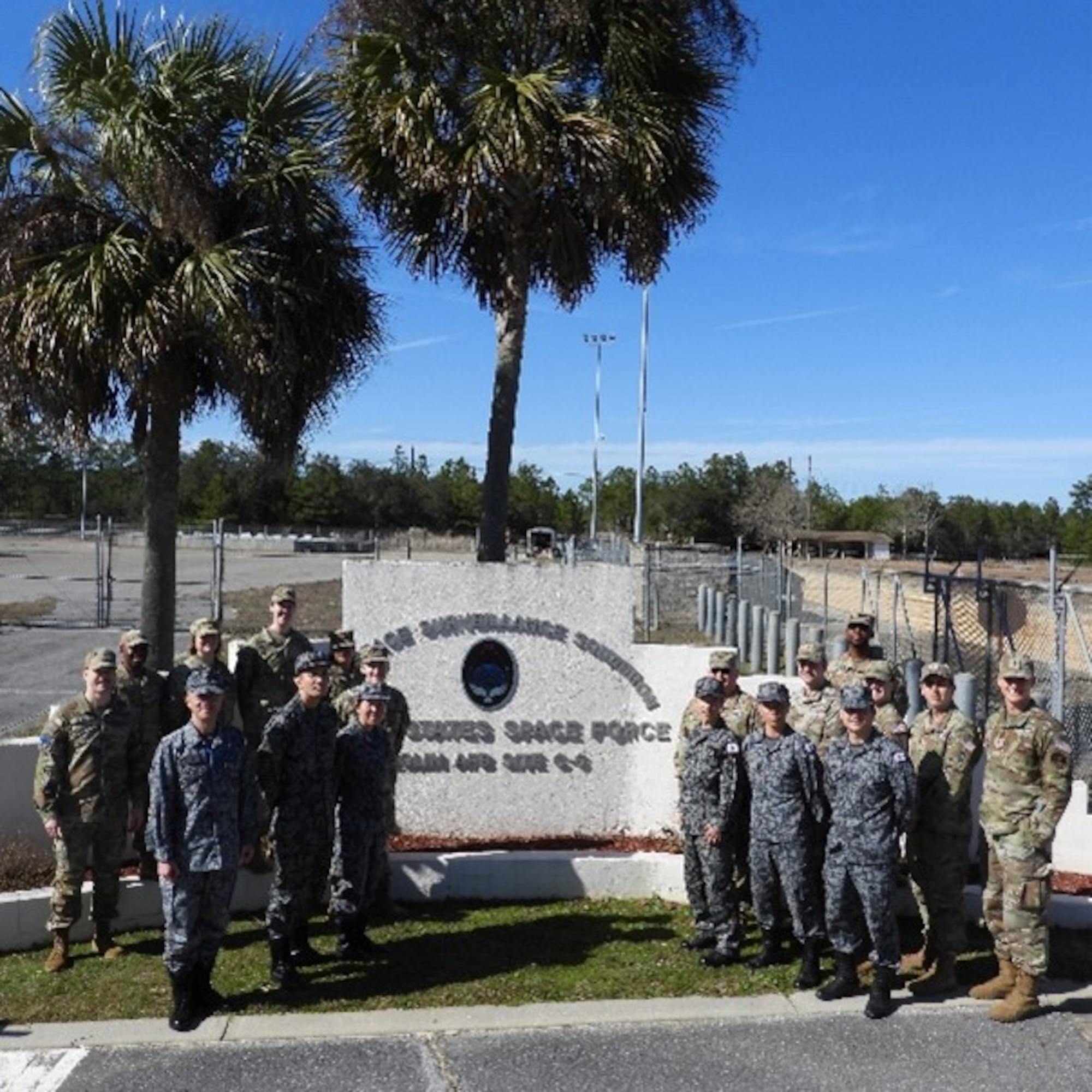 Operators from the Japanese Air Self-Defense Force, Space Operations Group, 1st Space Operations Squadron, and U.S. Space Force’s Space Delta 2 – Space Domain Awareness and Space Battle Management’s 20th Space Surveillance Squadron pose in front of 20 SPSS’s gate at Eglin Air Force Base, Florida, Jan. 29, 2024. Eglin AFB served as the first stop of a two-part visit for 1 SOPS operators and included an unclassified mission brief for the Delta’s AN/FPS-85 Phased Array Radar and observed a demonstration of the radar simulator. (U.S. Space Force Photo by 1st Lt Thomas Haskell)