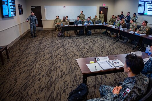  Japanese Air Self-Defense Force Capt. Yoshiki Iino, Space Operations Group, 1st Space Operations Squadron, provides a mission brief to members of Space Delta 2 – Space Domain Awareness and Space Battle Management’s 18th Space Defense Squadron at Vandenberg Space Force Base, California, Feb. 1, 2024. During the two-part visit, 1 SOPS operators traveled to Eglin Air Force Base and Vandenberg SFB to continue talks on space situational awareness data sharing and familiarization. (U.S. Space Force photo by Tech Sgt. Luke Kitterman)