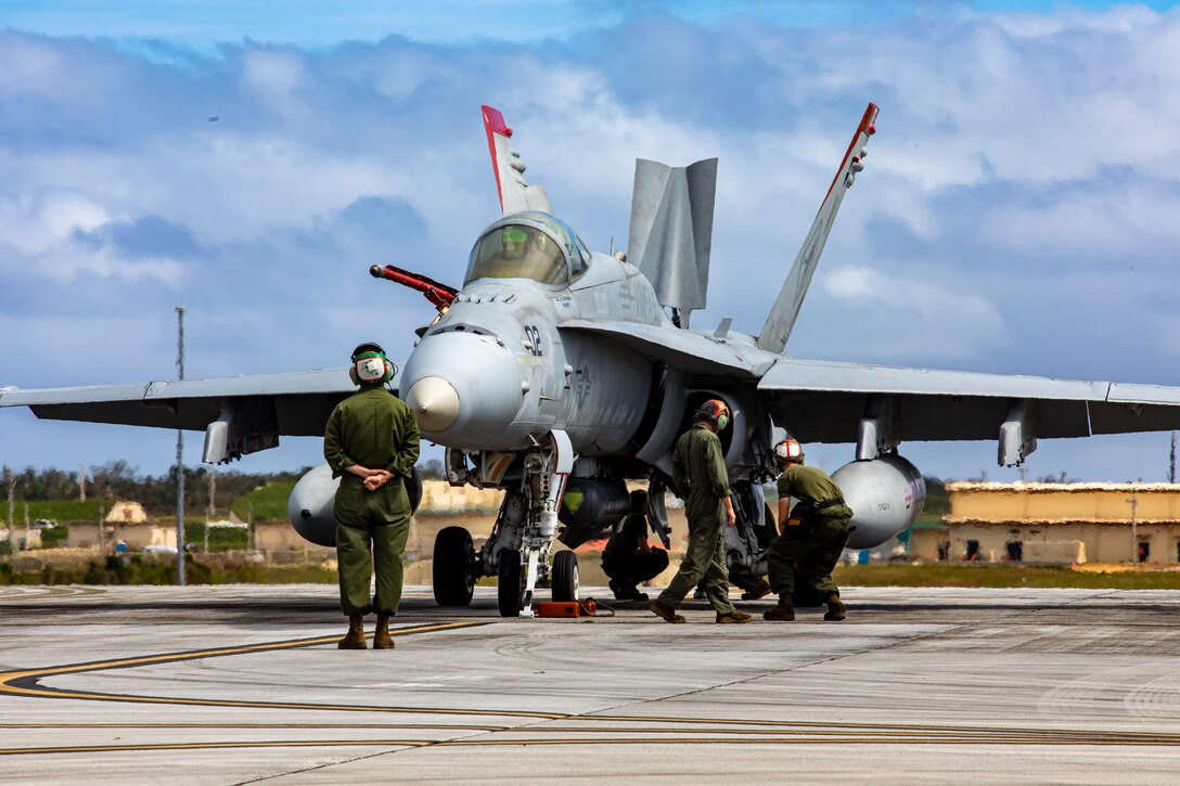 U.S. Marines with Marine Fighter Attack Squadron (VMFA) 232 performs preflight inspections on an F/A-18C Hornet aircraft at Andersen Air Force Base, Guam, Jan. 30, 2024. Nicknamed the “Red Devils,” VMFA-232 traveled from Marine Corps Air Station Iwakuni, Japan to Guam as a part of their Aviation Training Relocation Program deployment to train multilaterally with allies and partners, and enhance the squadron’s combat readiness. (U.S. Marine Corps photo by Lance Cpl. David Getz)