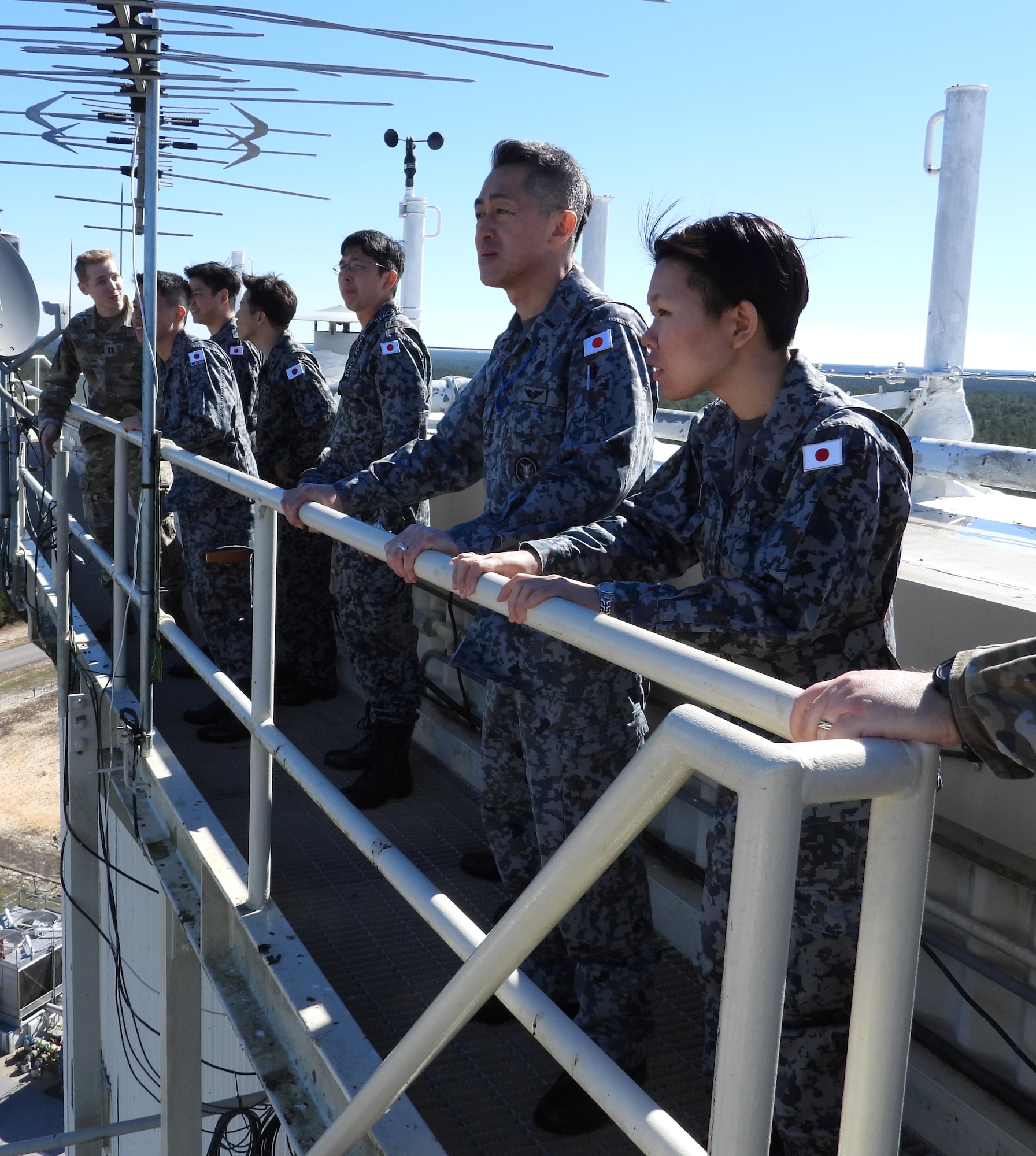 Operators from the Japanese Air Self-Defense Force, Space Operations Group, 1st Space Operations Squadron, look out from U.S. Space Force’s Space Delta 2 – Space Domain Awareness and Space Battle Management’s 20th Space Surveillance Squadron’s AN/FPS-85 Phased Array Radar catwalk at Eglin Air Force Base, Florida, Jan. 30, 2024. Eglin AFB served as the first stop of a two-part visit for 1 SOPS operators and included an unclassified mission brief for the Delta’s AN/FPS-85 Phased Array Radar and observed a demonstration of the radar simulator. (U.S. Space Force Photo by 1st Lt Thomas Haskell)