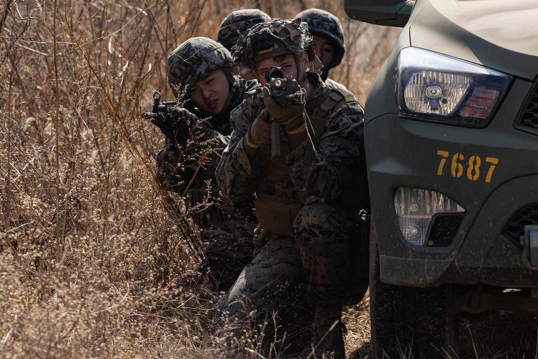 A U.S. Marines and Republic of Korea Marines take cover during Korea Viper 24.1 at Camp Mujuk, Republic of Korea, Feb. 7, 2024. Urban operations training strengthens Marines' proficiency in navigating and engaging in urban terrain, ensuring readiness through realistic training of close-quarters combat scenarios. In its first iteration, Korea Viper demonstrates the ROK-US Marine Corps ability to respond decisively in the region as a singular, unified force while strengthening relationships and trust between the two allies. The Marines are with 2d Battalion, 7th Marines. 2/7 is forward deployed in the Indo-Pacific under 4th Marine Regiment, 3d Marine Division as part of the Unit Deployment Program. (U.S. Marine Corps photo by Lance Cpl. Evelyn Doherty)