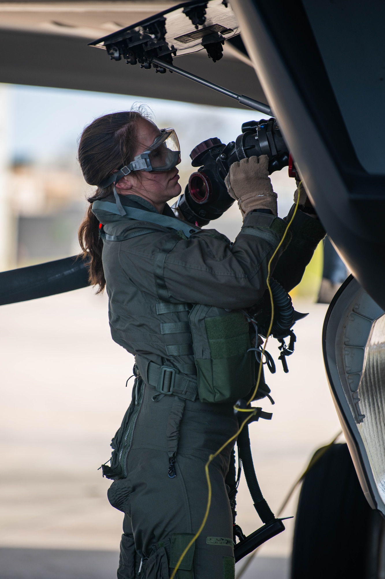 A pilot refuels a fighter jet.
