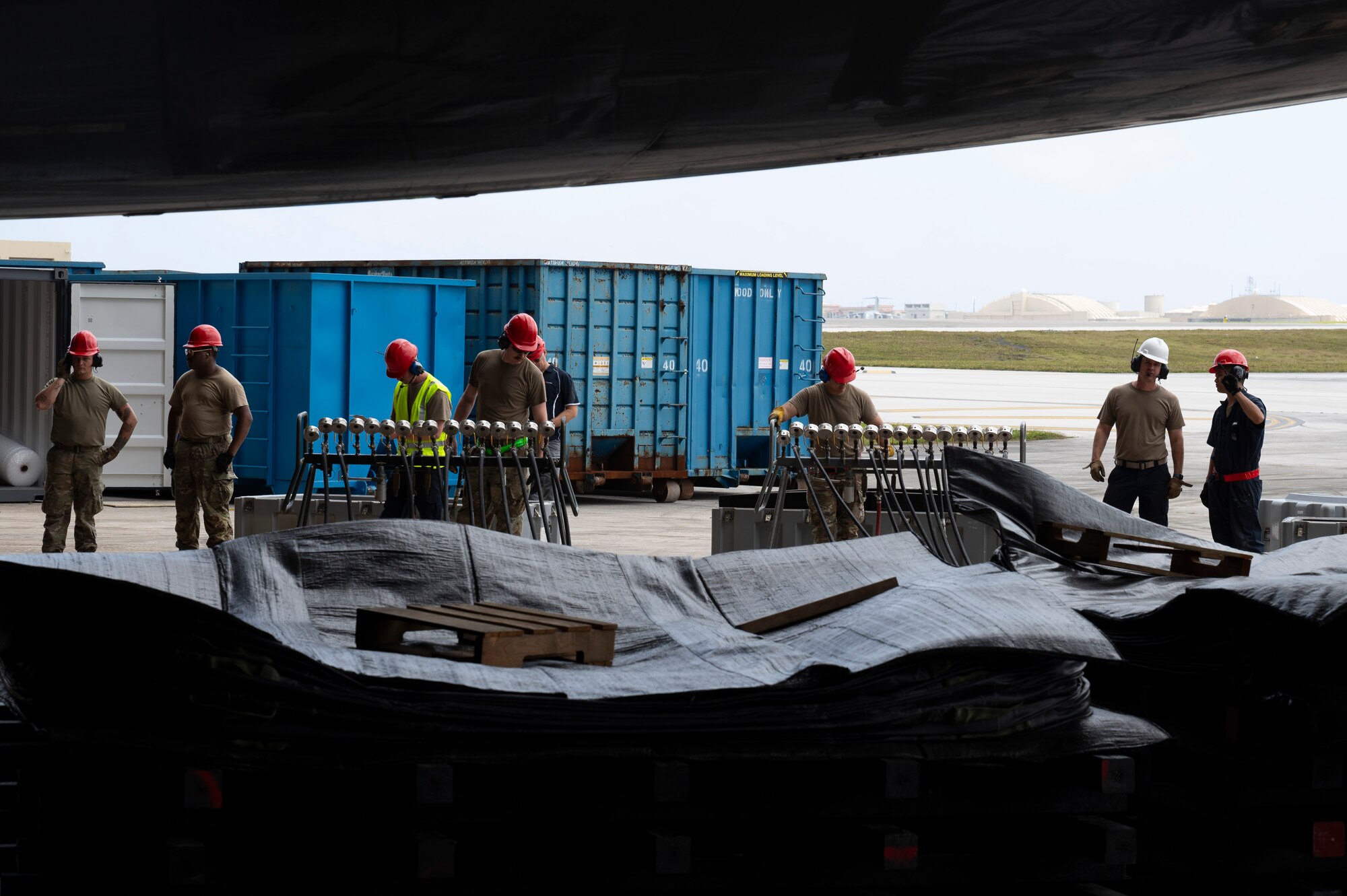 U.S. Air Force Airmen with the 36th Maintenance Squadron prepare to lift an A310 aircraft by inflating low pressure heavy aircraft lifting bags with pressure manifold modules on Andersen Air Force Base, Guam, Feb. 22, 2024. The Airmen had to lift the aircraft so that contractors could use an excavator to demolish it due to unrepairable damages. (U.S. Air Force Photo by Airman 1st Class Spencer Perkins)