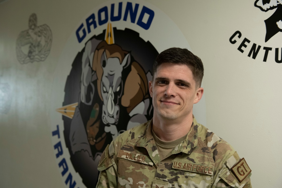 Tech. Sgt. Anthony Dillier, 35th Logistics Readiness Squadron ground transportation noncommissioned officer in charge, poses in front of a ground transportation logo at Misawa Air Base, Japan, Feb. 20, 2024.
