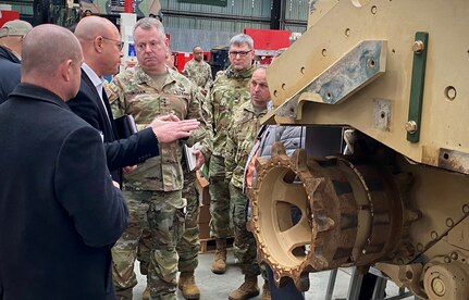 Gene Warren, the deputy general manager at Theater Logistics Support Center-Europe and Africa, briefs Lt. Gen. Christopher Mohan, the deputy commanding general of U.S. Army Materiel Command, at the MAK Feb 28. While at the MAK, Mohan got a first-hand look at the depot-level maintenance and full-spectrum services being conducted there.