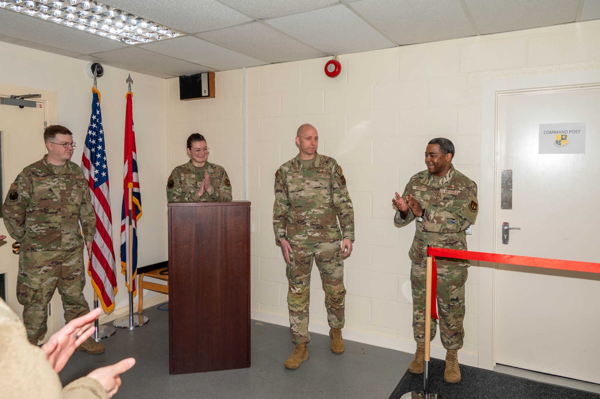 Pathfinders applaud during a ribbon cutting ceremony.