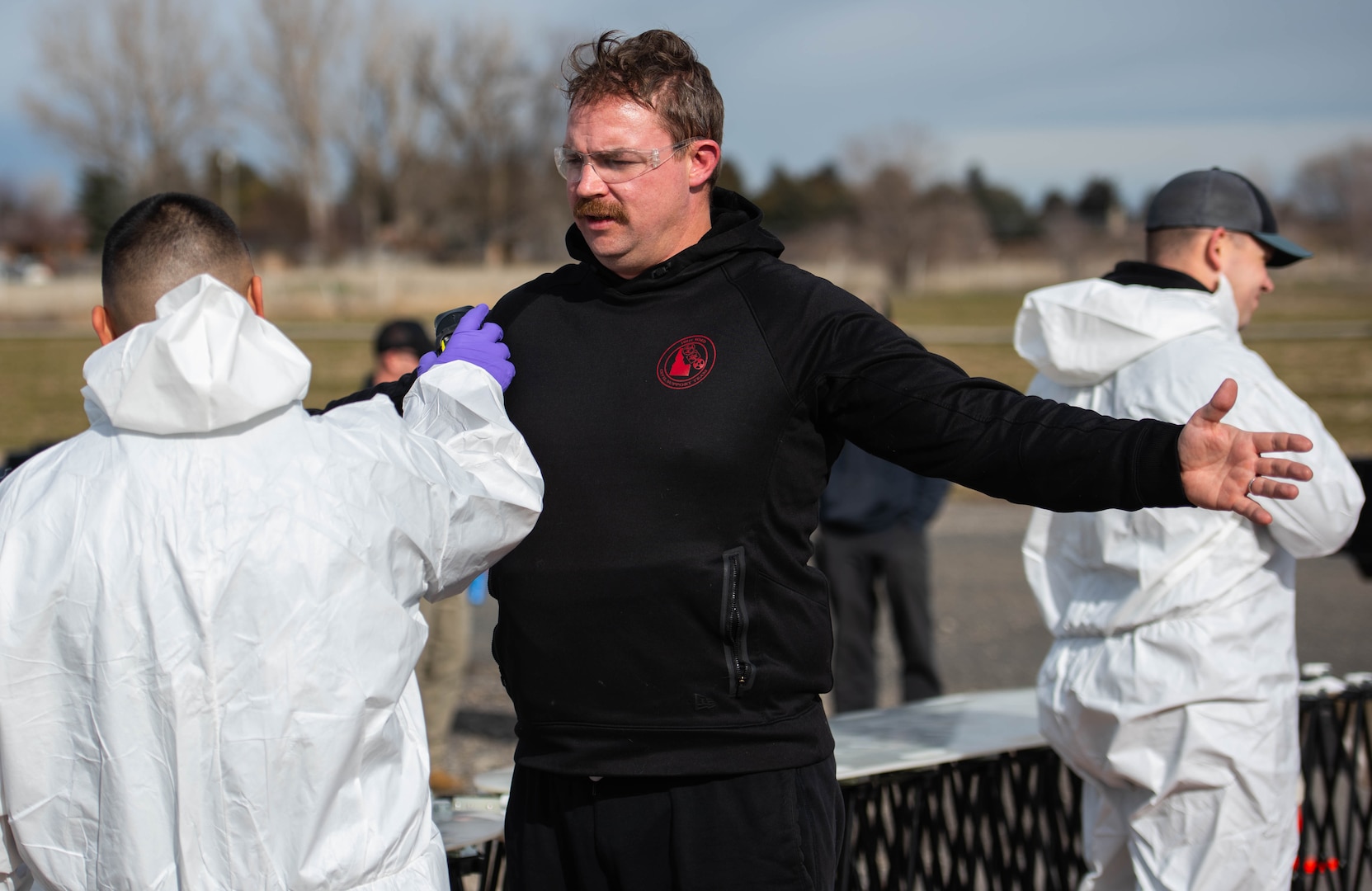 Sgt. Steven Jackson, 101st Weapons of Mass Destruction Civil Support Team, Idaho National Guard, goes through the decontamination process after exiting a notional “hot zone” during training with firefighters from the Bliss. Gooding and Hagerman Fire Departments. The CST’s community outreach program enhances the ability to work together in crises.