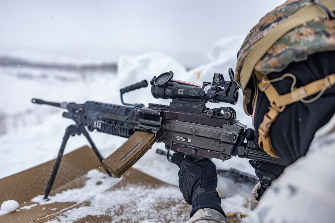 U.S. Marine Corps Lance Cpl. Jessiah Kirk, an equipment electrical systems technician with Combat Logistics Battalion 6, Combat Logistics Regiment 2, 2nd Marine Logistics Group, fires a M249 machine gun during a machine gun range in Setermoen, Norway, Feb. 21, 2024. CLB-6 is in Norway apart of Marine Rotational Forces Europe 24.1 which focuses on regional engagements throughout Europe by conducting various exercises, arctic cold-weather and mountain warfare training, and military-to-military engagements, which enhance overall interoperability of the U.S. Marine Corps with allies and partners. (U.S. Marine Corps photo by Lance Cpl. Christian Salazar)