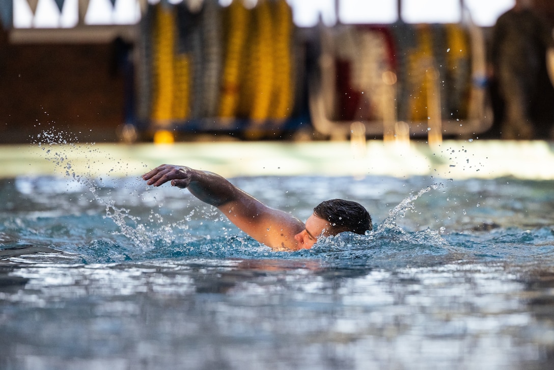 U.S. Marine Corps Capt. David Allen, an infantry officer with 3rd Battalion, 2d Marine Regiment, 2d Marine Division (MARDIV), conducts a 500 meter swim during the Division Leaders Assessment Program (DLAP) on Camp Lejeune, North Carolina, Feb. 22, 2024. DLAP is a rigorous course that tests and improves the warfighting abilities of leaders across 2d MARDIV. (U.S. Marine Corps photo by Lance Cpl. Eric Dmochowski)