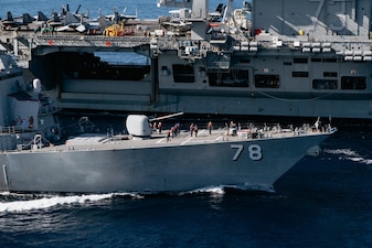 USS George Washington (CVN 73) replenishes USS Porter (DDG 78) in the Atlantic Ocean.