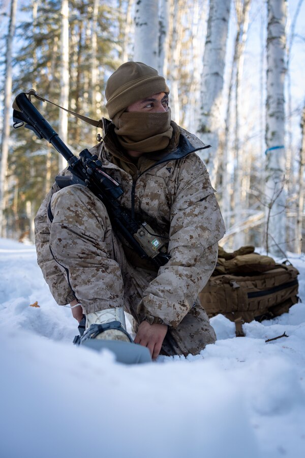 U.S. Marine Corps Lance Cpl. Daniel Gonzalez, an Automotive Maintenance Technician with Fox Battery, 2nd Battalion, 14th Marine Regiment, 4th Marine Division, Marine Forces Reserve, secures his snowshoes during a cold weather class during exercise Arctic Edge 2024 at Eielson Air Force Base, Alaska, Feb. 25, 2024. The class covered essential techniques needed for successful operations in extreme cold weather environments, enhancing the Marines' preparedness for arctic conditions. Arctic Edge 2024 (AE24) is a U.S. Northern Command-led homeland defense exercise showcasing the military's capabilities in extreme cold weather, highlighting joint force readiness, and reinforcing the U.S. military's commitment to mutual strategic security interests in the arctic region. Gonzalez is a native of Tulsa, Oklahoma. (U.S. Marine Corps photo by Lance Cpl. Madisyn Paschal)