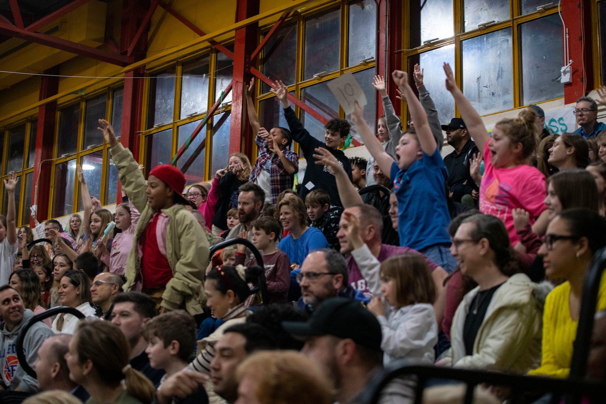The crowd cheers during a performance by the Harlem Globetrotters at RAF Alconbury
