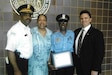 Chicago Police Officer and Army Reserve Soldier Diane Mason, third from left, pauses for a photo after receiving an award for outstanding Police work with Chicago Police Commander Eddie Johnson, left, and former Chicago Police Superintendent Jody Weis, right.
(Courtesy photo by Master Sgt. Diane Mason)