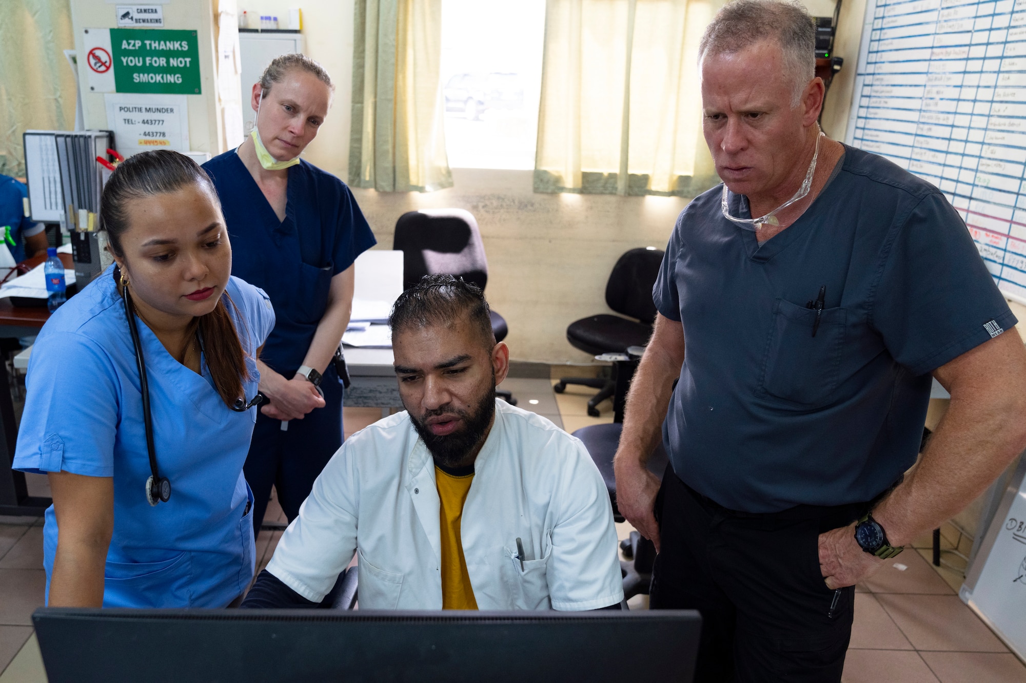 U.S. Air Force reservists and local Suriname emergency room physicians assess a patient’s CT-Scan at Paramaribo’s Academic Hospital in Suriname, Feb. 20, 2024.