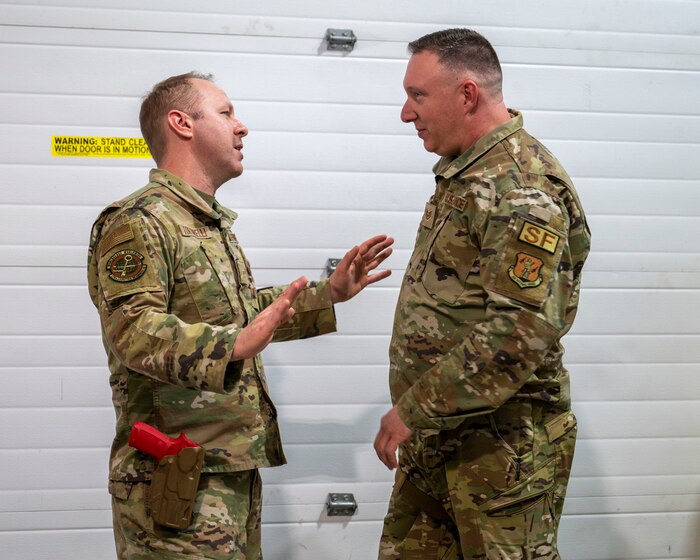 U.S. Air Force Airman 1st Class Brian Tortorelli, a material management specialist with the 174th Logistics Readiness Squadron, and Staff Sgt. Bryce Dates, a security forces specialist assigned to the 174th Security Forces Squadron, roleplay a training scenario during a security forces augmentee course at Hancock Field Air National Guard Base, Feb. 14. During the course members of the 174th Security Forces Squadron trained Airmen from across the wing to serve as additional duty security forces augmentees. (U.S. Air National Guard photo by Alexander Rector)