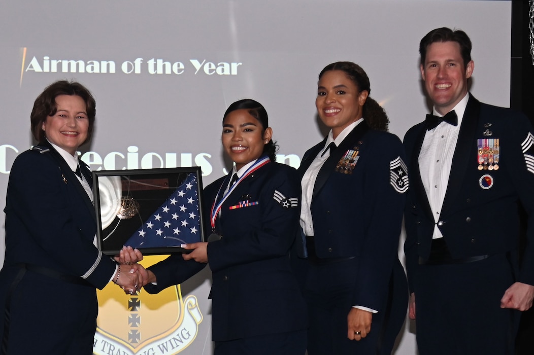 U.S. Air Force Col. Angelina Maguinness presents the Airman of the Year award to Senior Airman Precious Jones during the 2023 Annual Awards Ceremony at the First Financial Pavilion, San Angelo, Texas Feb. 24, 2024. This year’s guest speaker was U.S. Air Force Chief Master Sgt. Alex J. Eudy, Senior Non-Commissioned Officer Academy commandant. (U.S. Air Force photo by Airman James Salellas)